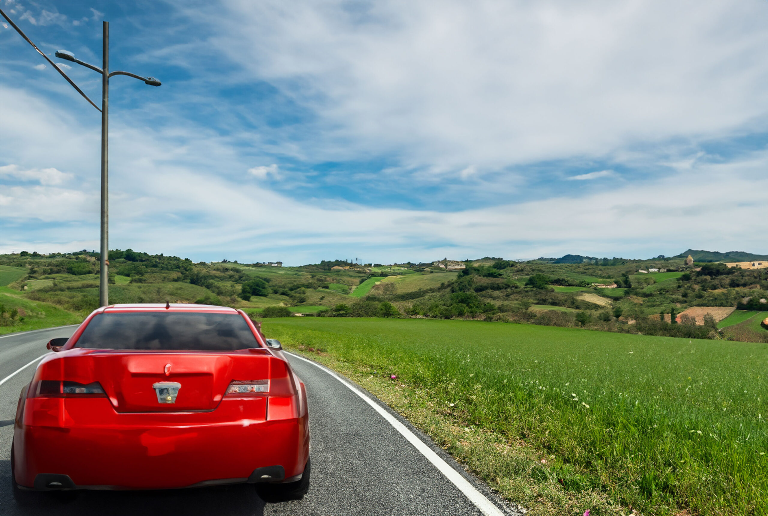 Auto elettrica su un paesaggio italiano - AI di Adobe Creator